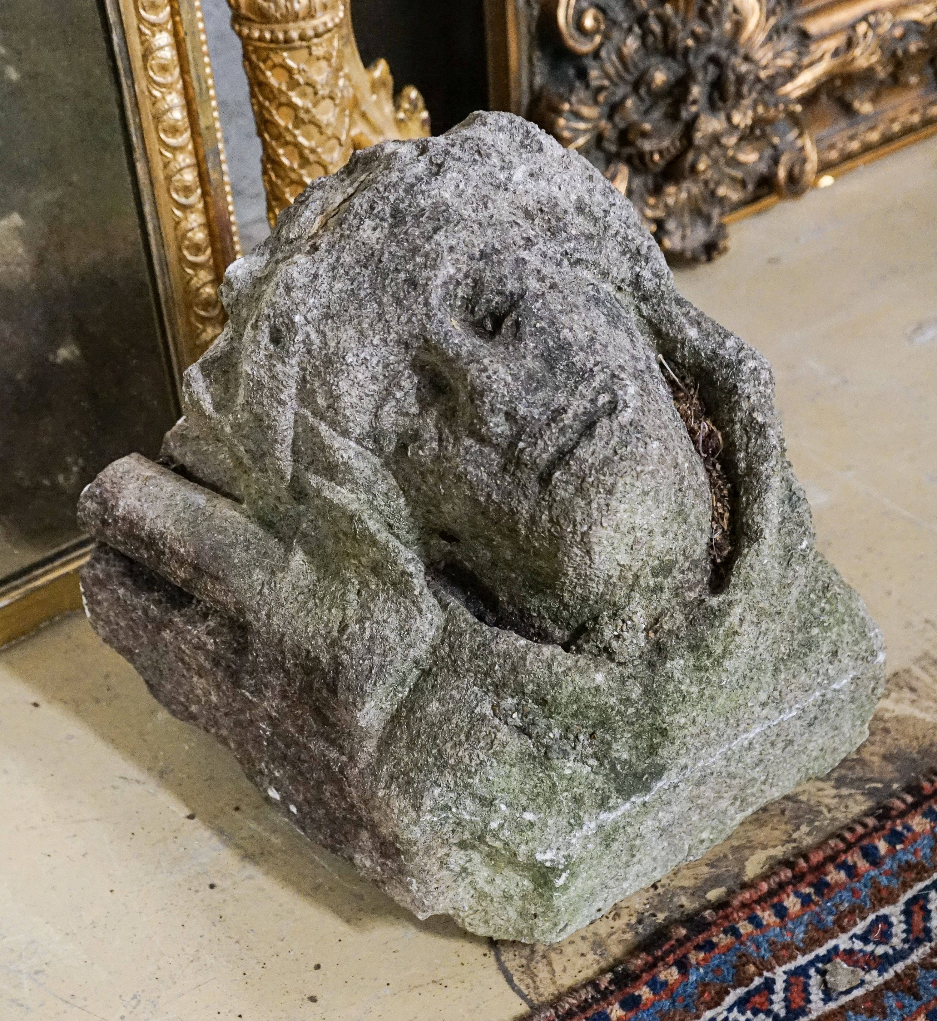 An antique carved stone corbel, width 30cm, height 28cm